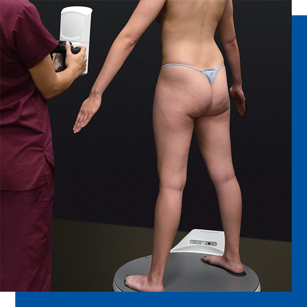 A patient being photgraphed while standing on an automated turnable called IntelliStage